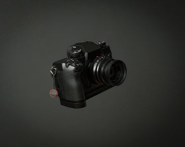 small mirrorless camera on grey background