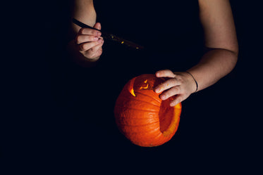 small pumpkin being carved