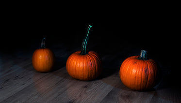 small pumpkins in a dark room