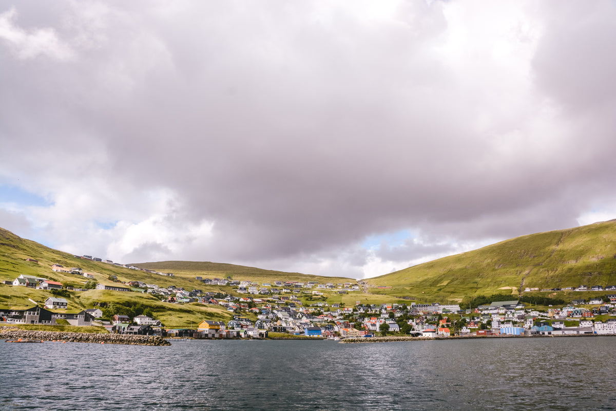 small village clings to hillside off faroe islands