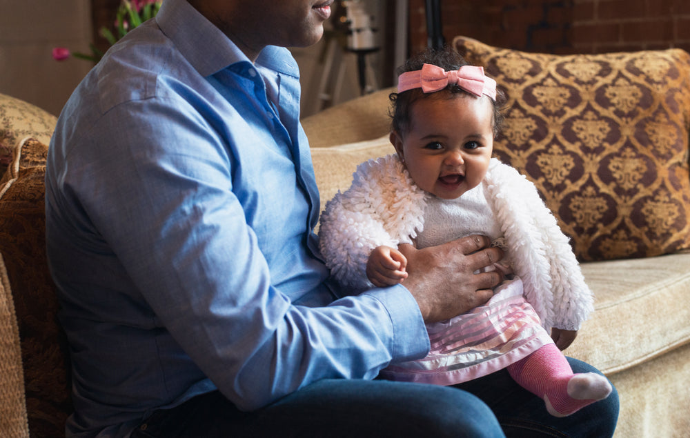 smiling baby on lap