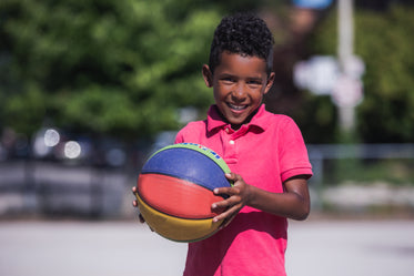 smiling boy with basketball