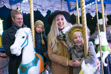 smiling family on merry go round