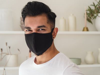 Smiling Man In Black Cloth Face Mask