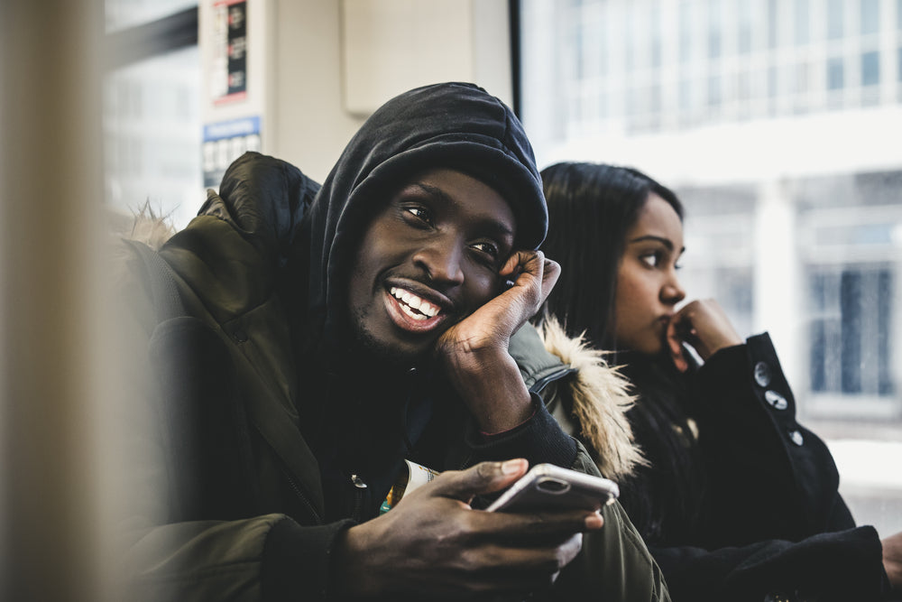 smiling man on bus