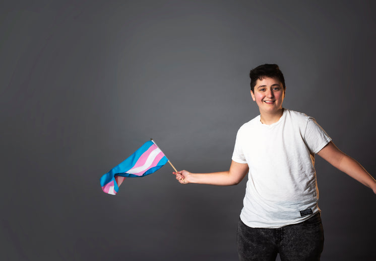 smiling-person-waving-trans-pride-flag.j
