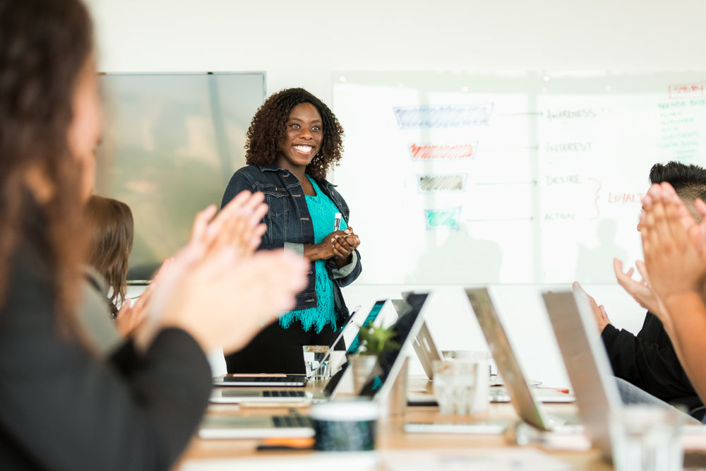 smiling woman leading meeting