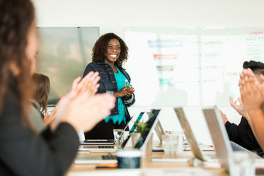 Free Smiling Woman Leading Meeting Photo — High Res Pictures