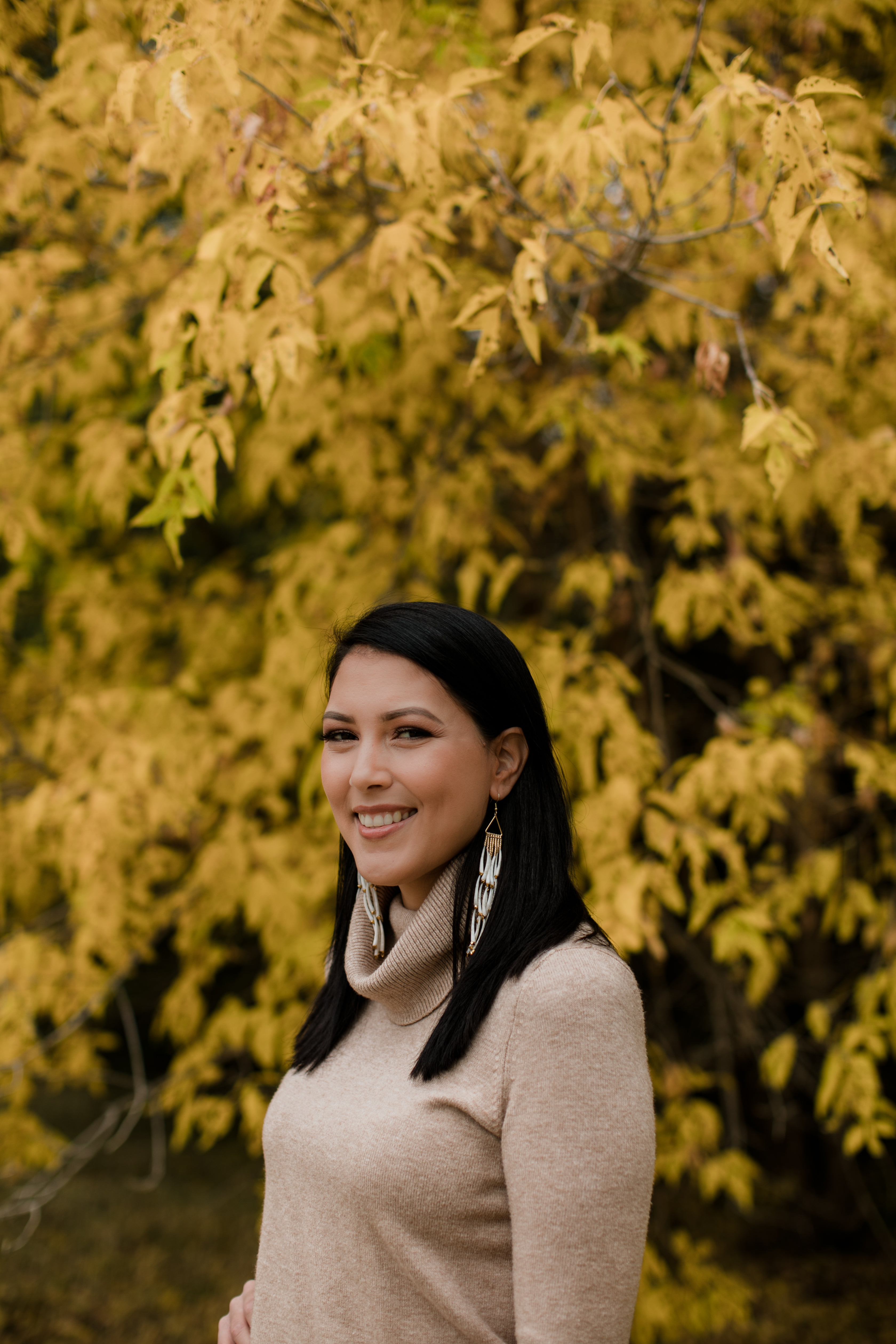 Smiling Woman Looks Towards A Camera