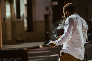 smoking man on cell phone