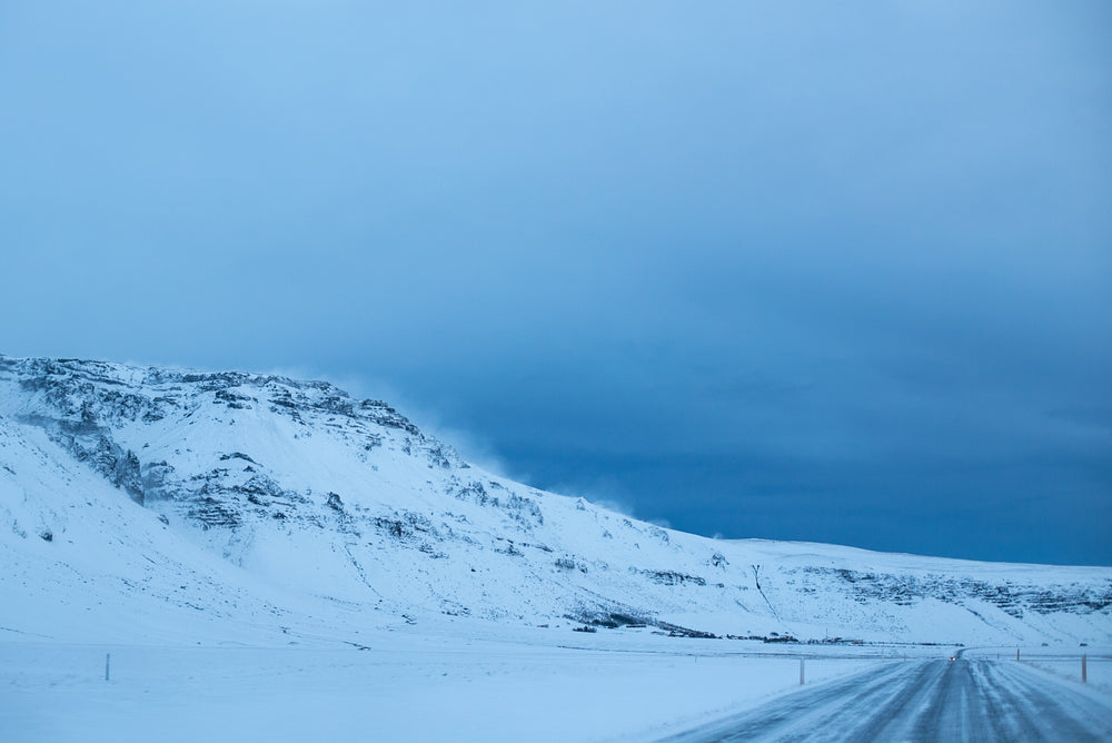 snow capped iceland hillside