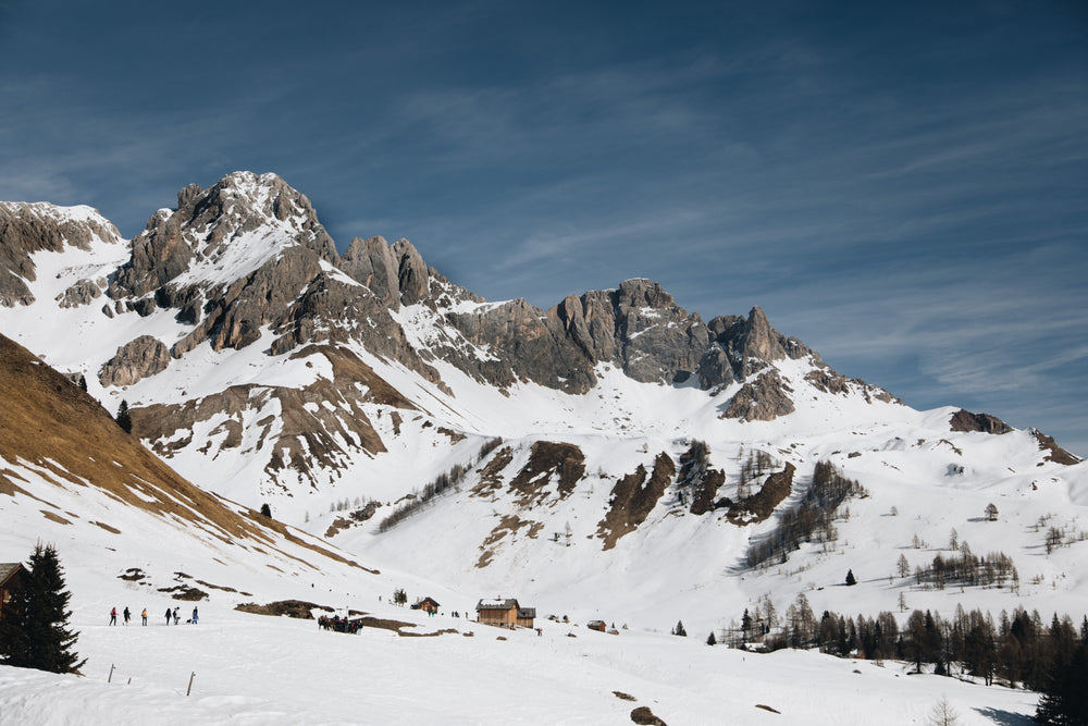 snow cascading down mountain range