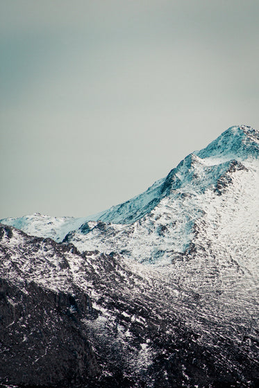 snow covered black rocked peaks