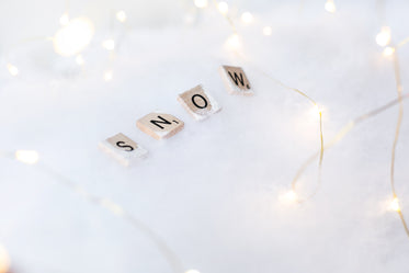 snow letter tiles on white