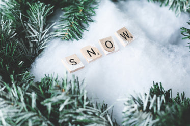 snow letter tiles with winter greens