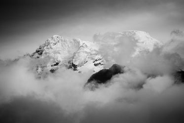 snow tips in clouds