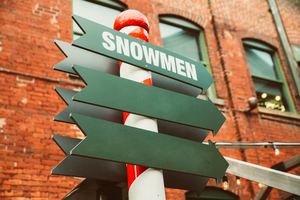 snowman arrow sign