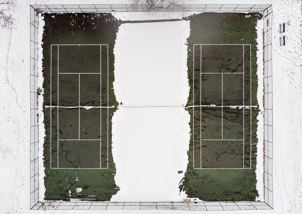 snowy tennis court from bird's-eye view