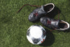 soccer cleats and ball