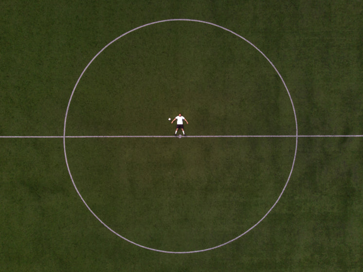 soccer-player-laying-in-the-center-circl