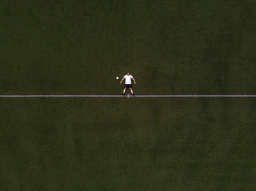 soccer player laying in the center line