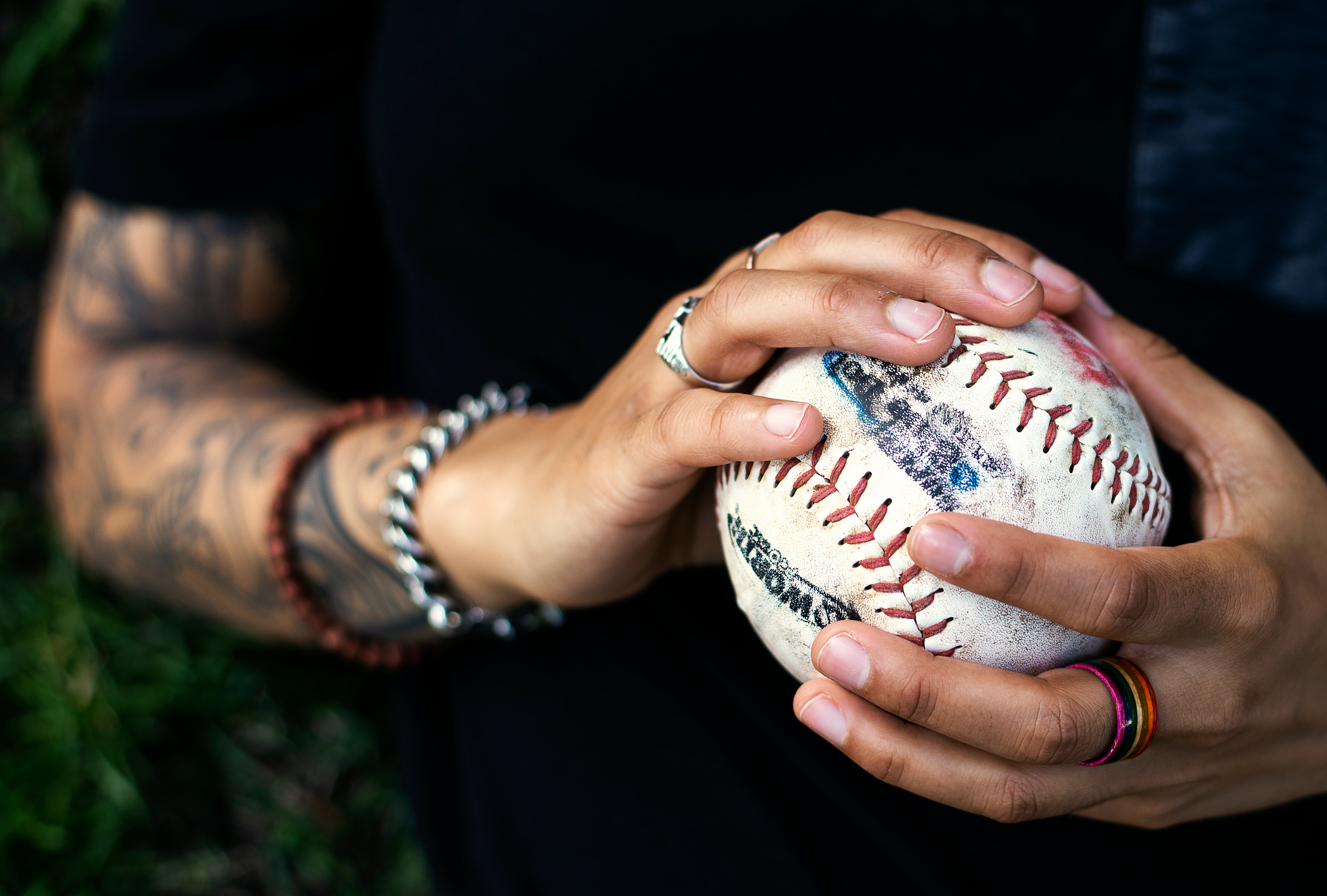 Free Tattooed Arm Tosses Baseball Photo — High Res Pictures