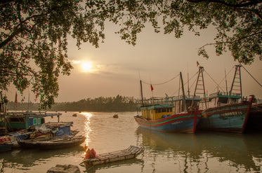 some colorful boats docked in calm water