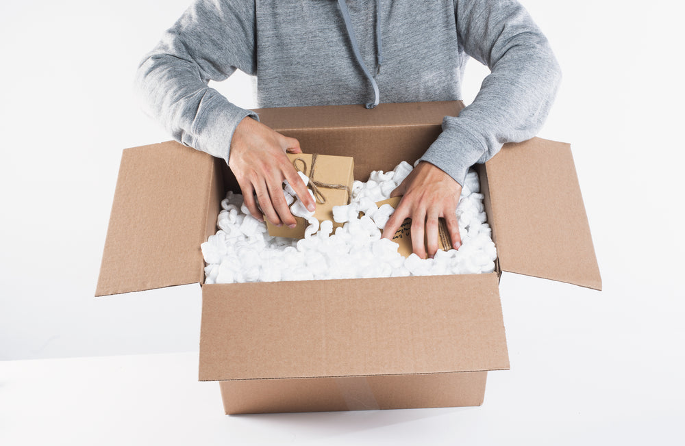 some packages being placed into packing materials