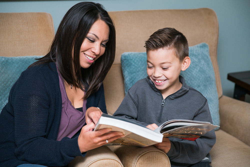 son and mother reading