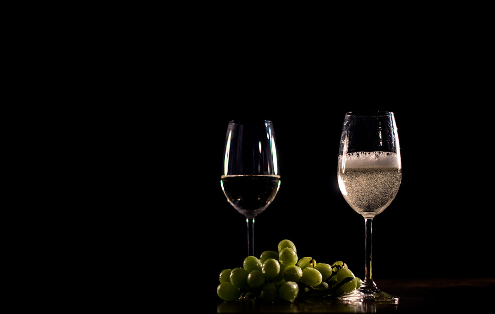 sparkling white wine and grapes