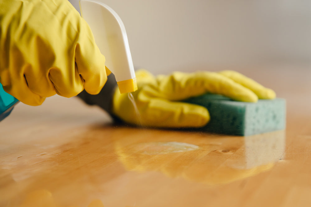 spaying cleaner on wood