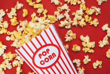 spilled popcorn on a red background