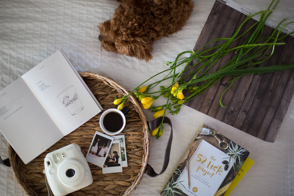 spring essentials on a bed