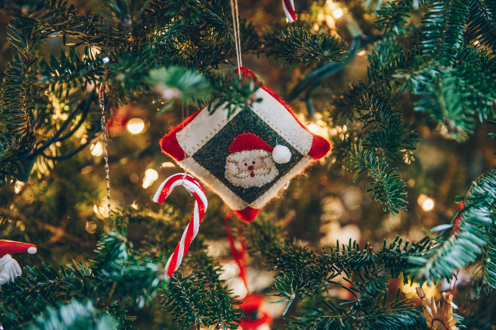 square santa ornament on tree