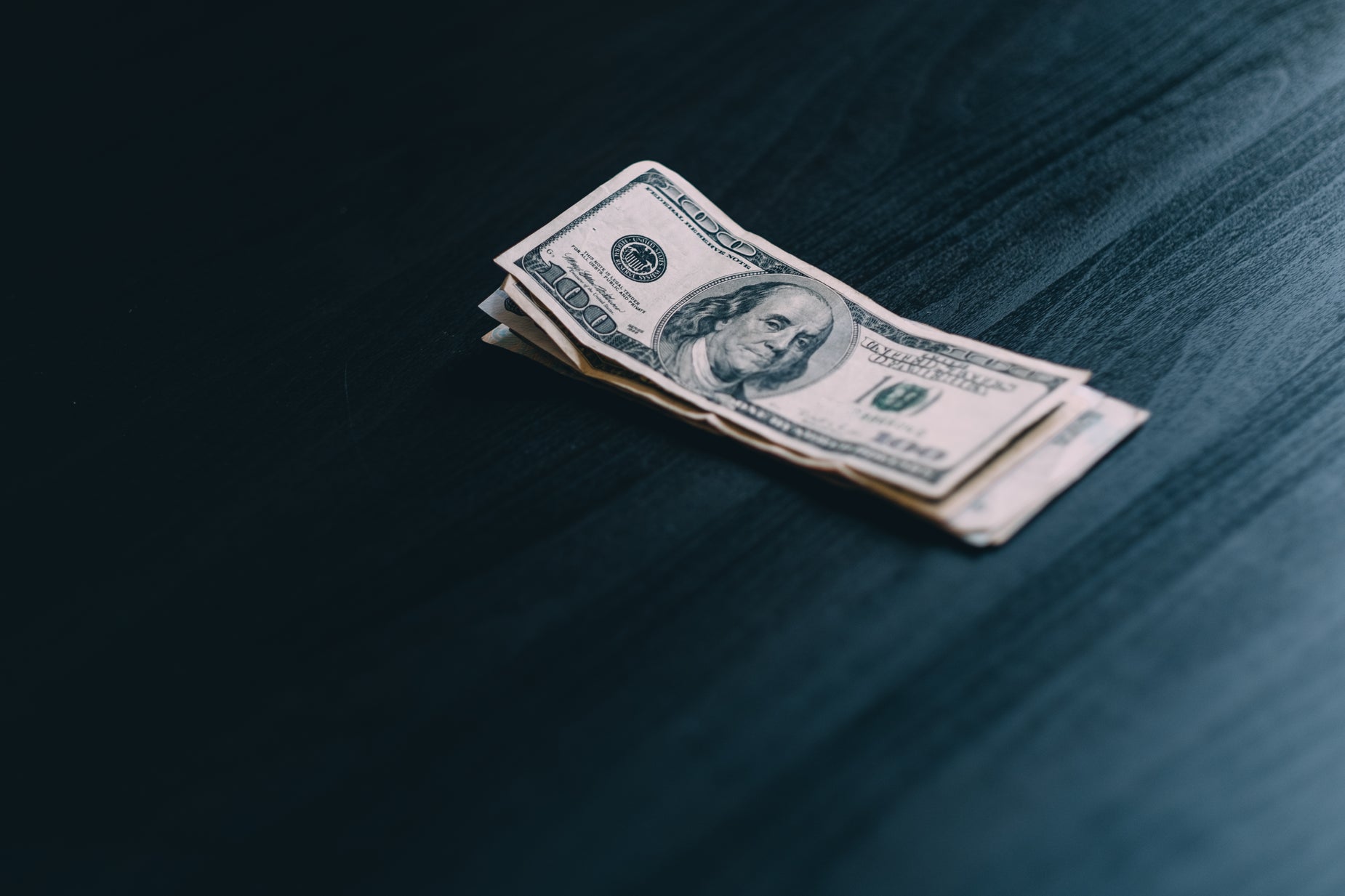 Browse Free HD Images of Stack Of Money On A Wood Grain Surface