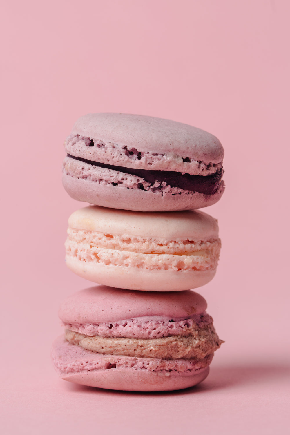 stack of pink macarons on pink