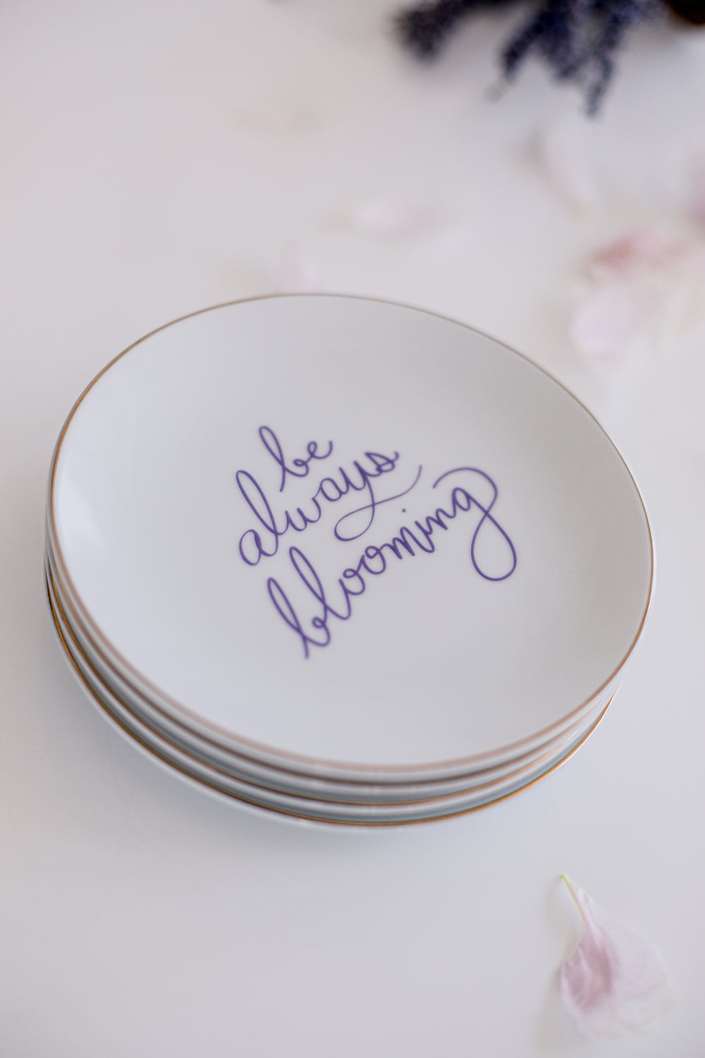 stack of white plates with the text inlaid