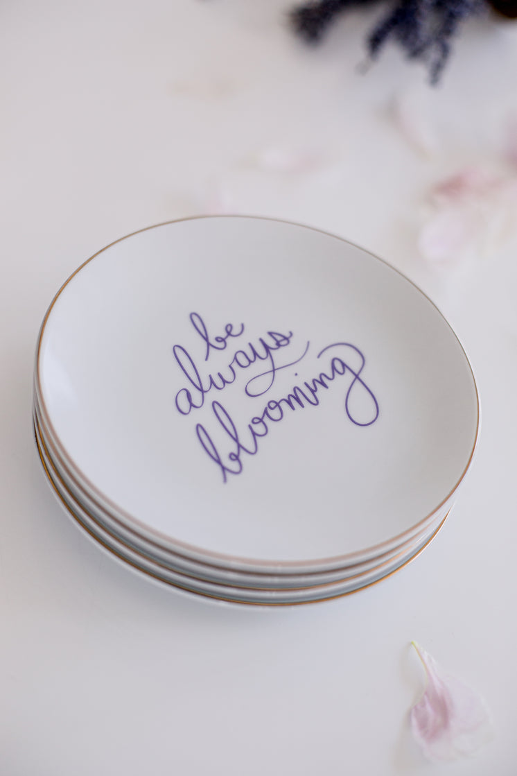 Stack Of White Plates With The Text Inlaid