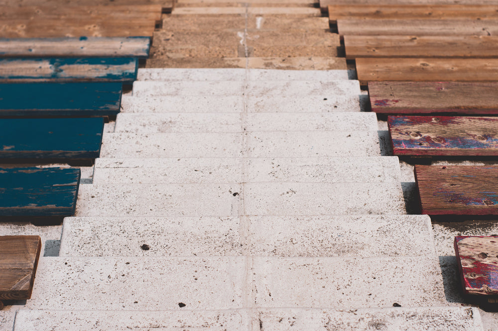 stadium risers and worn wooden bench seating