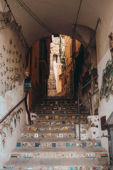 staircase in an arched tunnel with mosaic deatils