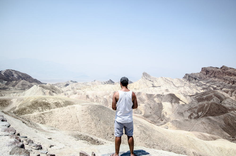 standing above expansive sand dunes