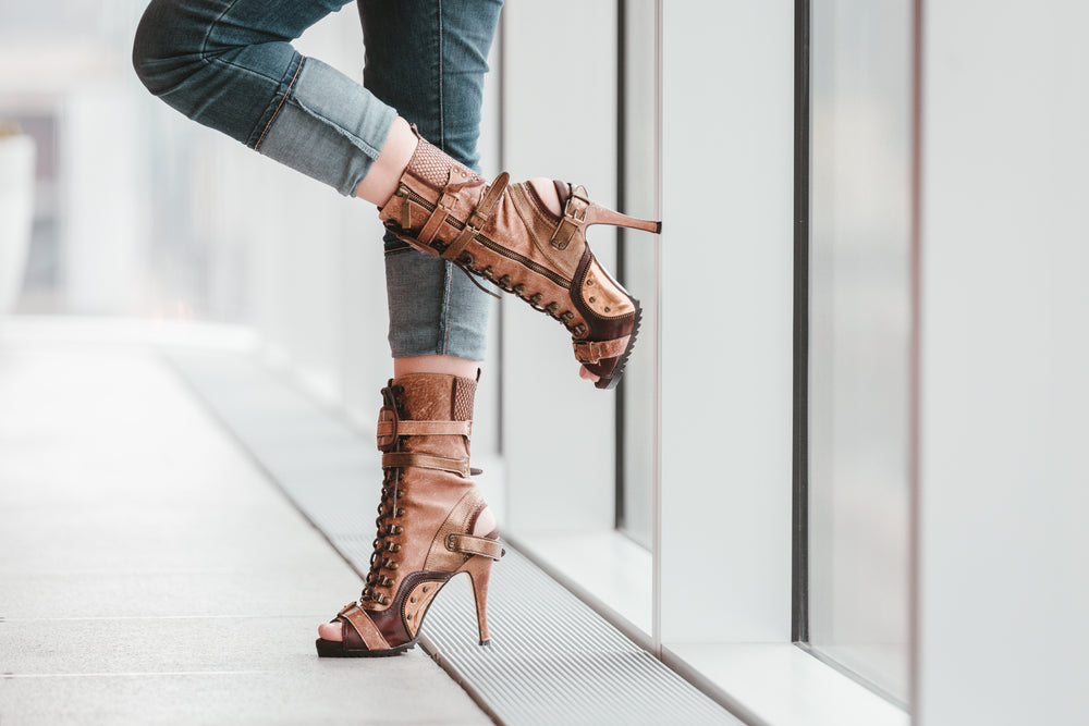 standing by a window in heels