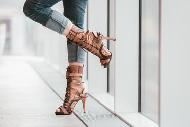 standing by a window in heels