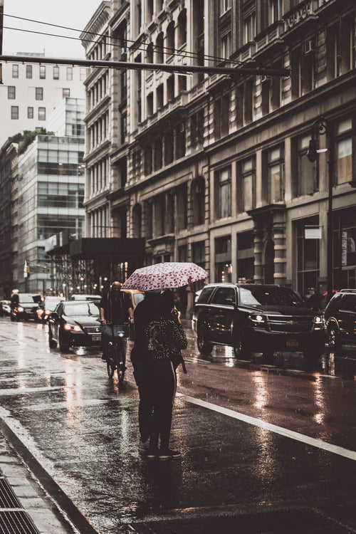 standing in the rain in the city