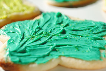 star cookie with green icing and sprinkles