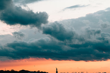 statue of liberty under sunset