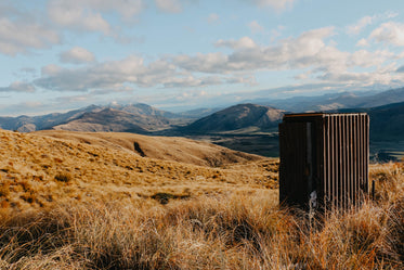 steel building in grassy foothills