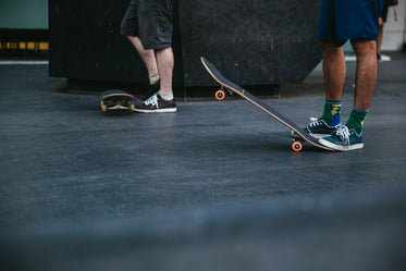 stepping on skateboard