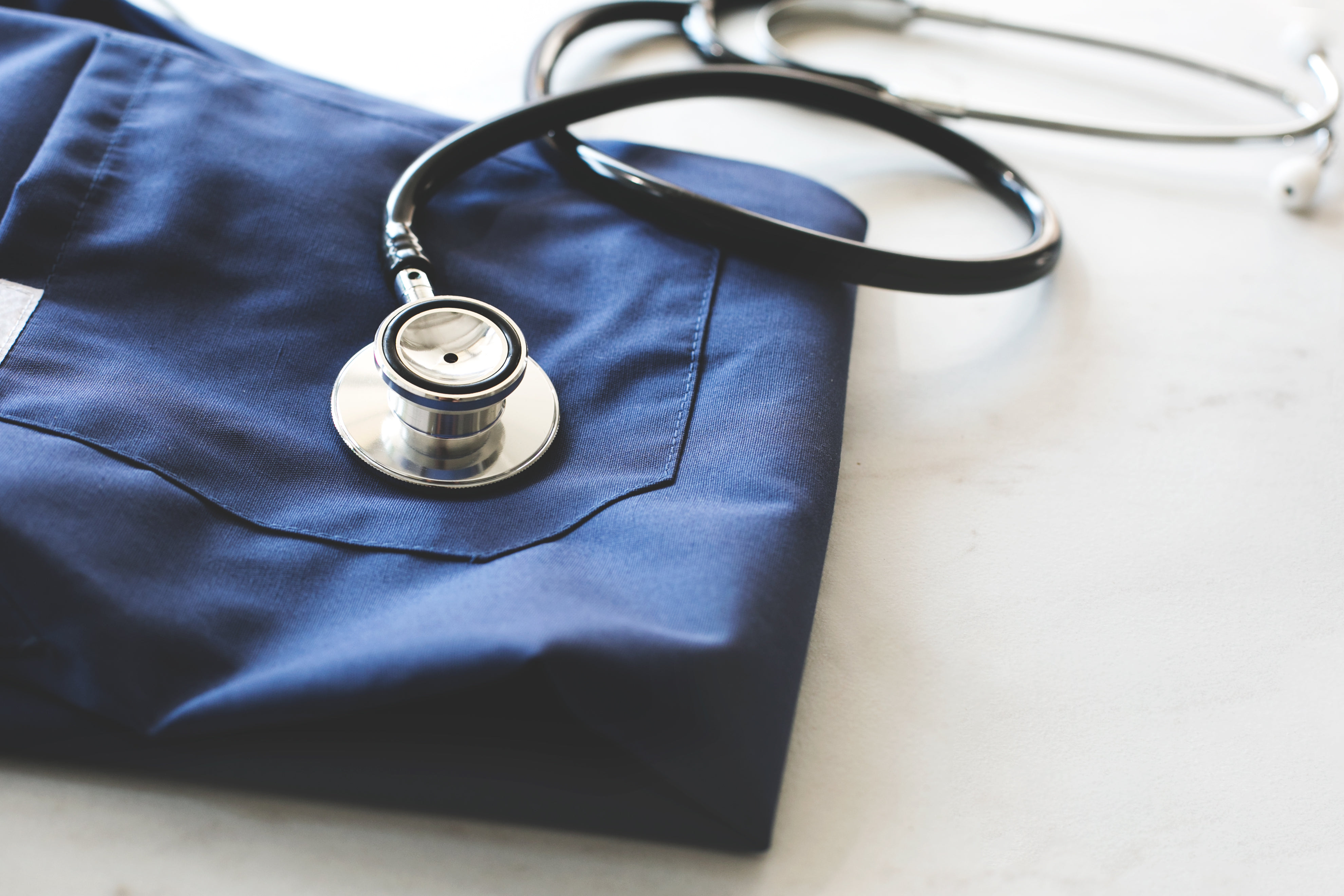 used stethoscope and pharmacy pills on blue background as medical concept  Stock Photo - Alamy