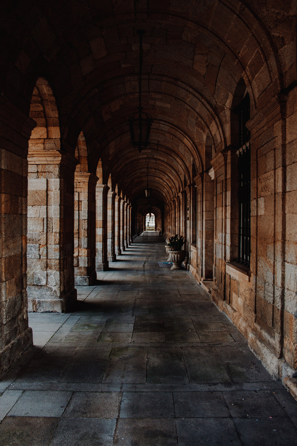 stone arched hallway to courtyard